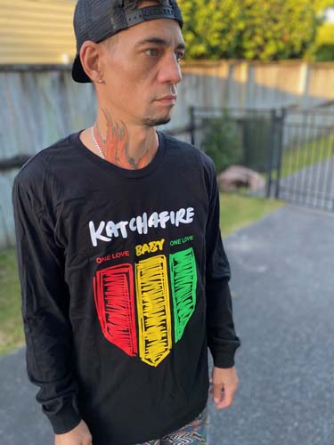 The Katchafire One Love Long Sleeve Tee is a fun, vibrant unisex tee.  The tri colour shield features with the lyrics of Love Letter... One Love Baby
