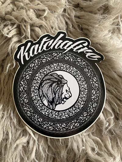 The Katchafire Mandala Sticker is a large sticker, custom shaped in the Mandala design.  This design will be sure to stand out wherever you put it!