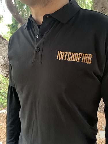 The Katchafire Polo Shirt is available in Navy and Black.  With a Katchafire text logo on the left chest.  Contrasting Embroidery colours.  S - 5xl.