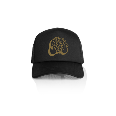 The Black Seeds Classic Bubble Trucker Cap is a fan favourite.  Your opportunity to get in alternative colours.  Gold print on front of cap. 
